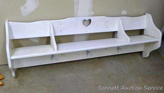 4' wide display shelf with pegs. This would work well in an entry way.