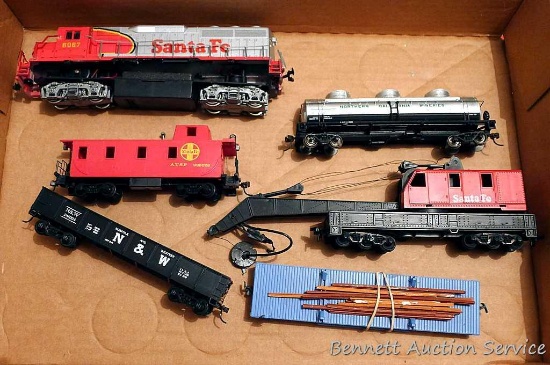 Model railroad HO scale pieces including Bachmann Santa Fe engine, Bachmann Northern California