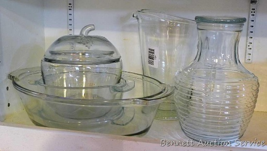 Anchor Hocking juice carafe is 9" tall and has a rubber seal on lid; glass pitcher, casserole dishes