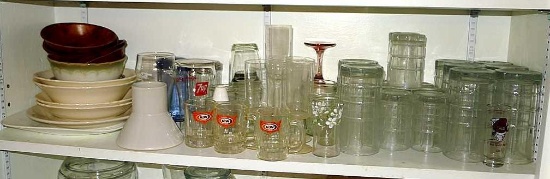 Assorted drinking glasses, juice glasses, A&W mugs, 7-UP glass, Coca-Cola glass, shakers, a mix of
