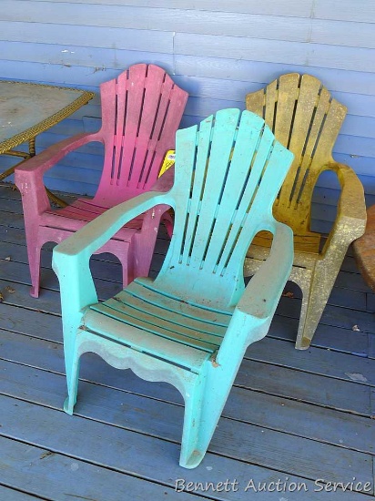 Three colorful Adirondack chairs look to be in good condition and should clean up nicely. Measure