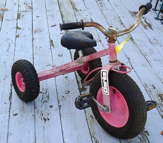 Clarke tricycle has wagon hitch and looks like it?s ready for some fun. Tires hold air, measures