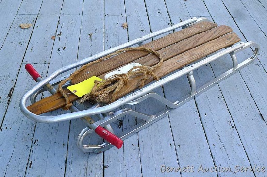 Vintage Duralite Racer sled has arms so you can steer it. Measures 25" x 54" x 8" and looks to be in