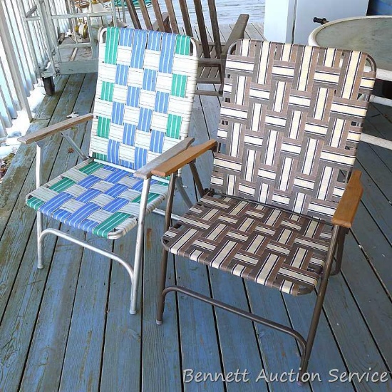 Two folding lawn chairs, brown one is of nicer quality and stands 26" x 22" x 37" high.
