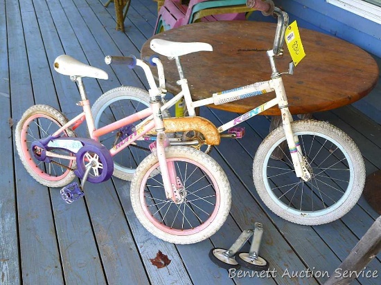 Huffy and Kent kids bicycles and a pair of training wheels. Larger bike is about 51" x 37" high,