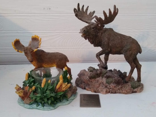 Two moose figurines, one with a candle holder. Larger one is 7-1/2" tall.