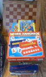 Stack of games includes Word Hangman, Scruples, True Colors, Imaginiff, Whac-A-Mole, Fact or Crap,