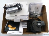 Olympus Infinity SuperZoom 330 camera has manual; Sony Handycam model DCR-SX44, comes with original