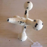 Cast iron replica of a toy jack could be used as a paper weight. Center is 6