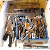 Two utensil organizers with assortment of silverware and sharp knives.
