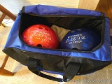 His & Hers Brunswick bowling balls in a Brunswick bag.