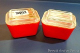 Two red Pyrex small size refrigerator dishes with lids. Good condition.