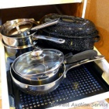 Smaller enameled roaster, double boiler, saucepans, grill pan. All in good condition.