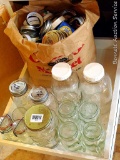 Two quart Presto and Atlas jars; a few smaller canning jars and canning jar style mugs, plus a paper