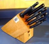 J.A. Henckels knife set with wooden block. Knives include serrated knife, chef's knives, paring