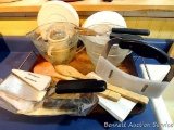 Pampered Chef pizza stone with rack, wooden spoons, 4 cup batter bowls with lids, pie slice/server,
