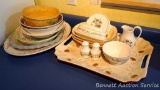 Large platters including a Christmas platter, pie plate, serving bowls; creamer, butter dish, napkin