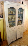 Very charming cabinet with glass doors on top, the drawers and paneled doors have a pressed design