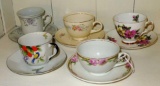 Collection of 5 different teacups and their matching saucers.