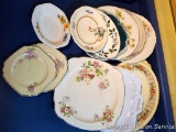 Collection of different sized plates and small platters and bowl.
