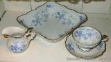 Pretty blue floral printed serving bowl with matching creamer and cup and saucer; all stamped
