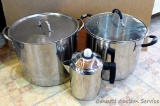 Two stainless steel stock pots and coffee pot; largest stock pot measures 11-1/4