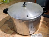 Presto Pressure Canner and Cooker, includes regulator, seal and instruction manual; measures 12-1/2