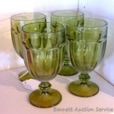 Four retro green glass goblets are 7