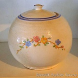 Vintage round or ball canister has uniform crazing and pretty flowers. Measures approx. 8