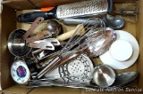 Nice kitchen utensils including stainless measure cups, serving spoons, sauce or butter cups, whisk,