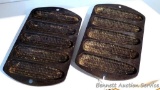 Two cast iron corn bread stick pans in good shape. Each measures 5-1/2