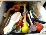 Kitchen utensils including a neat apple corer, pastry blender, baster, thermometers, measure cups,