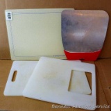 Two large plastic cutting boards, one glass cutting board is 12
