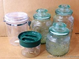 Greenish glass canister set, tallest is 9-1/2