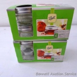 Two new pkgs. of 4 wide mouth half pint jars with bands and lids