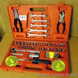 Handy household tool kit with combination wrenches, plyers, sockets, more. Case measures 15