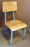 Cute little child's school chair is sturdy and in good condition.