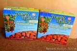 Two new in package Topsy Turvy upside down strawberry planters.