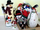 Variety of snowmen ornaments and decorations. Smallest Christmas ornaments are each approx. 2