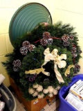 Several wreathes, plus a nearly 2' wide Christmas tree stand. Wreaths with lights work as they