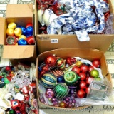 Christmas tree trimmings including ornaments of all kinds and sizes, bows, beads, ribbon and more.
