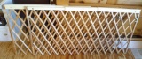 Two Evenflo wooden expandable door gates for openings between 24