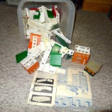 Plastic tote with construction pieces for making buildings. Tote is 12