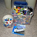 Lots of Lego pieces for large building projects. Plastic tote filled with pieces is 8