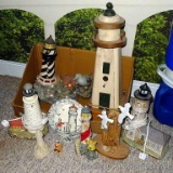 Collection of wooden and plaster lighthouse figurines. Largest is 20