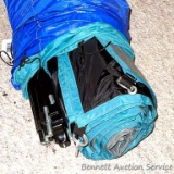 A camping tent. We didn't take this out of the bag so we don't know what size it is. Poles are