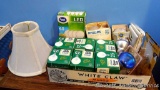 Small lamp shade with various light bulbs including LED, 25W globe bulbs, 40W candelabra bulbs and