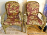Two matching sturdy porch chairs are a larger size than most this style. Both in good shape overall