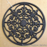 Interesting cast metal trivet or wall hanging; measures 12