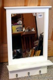 Entry mirror with shelf and hooks measures 28